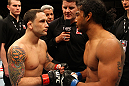 SAITAMA, JAPAN - FEBRUARY 26:  (L-R) Opponents Frankie Edgar and Benson Henderson touch gloves before their Lightweight Championship bout during the UFC 144 event at Saitama Super Arena on February 26, 2012 in Saitama, Japan.  (Photo by Al Bello/Zuffa LLC/Zuffa LLC via Getty Images) *** Local Caption *** Frankie Edgar; Benson Henderson