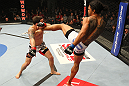 SAITAMA, JAPAN - FEBRUARY 26:  (R-L) Benson Henderson kicks Frankie Edgar during the UFC 144 event at Saitama Super Arena on February 26, 2012 in Saitama, Japan.  (Photo by Al Bello/Zuffa LLC/Zuffa LLC via Getty Images) *** Local Caption *** Frankie Edgar; Benson Henderson