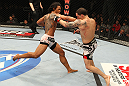 SAITAMA, JAPAN - FEBRUARY 26:  (L-R) Benson Henderson punches Frankie Edgar during the UFC 144 event at Saitama Super Arena on February 26, 2012 in Saitama, Japan.  (Photo by Al Bello/Zuffa LLC/Zuffa LLC via Getty Images) *** Local Caption *** Frankie Edgar; Benson Henderson