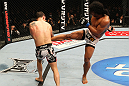 SAITAMA, JAPAN - FEBRUARY 26:  (R-L) Benson Henderson kicks Frankie Edgar during the UFC 144 event at Saitama Super Arena on February 26, 2012 in Saitama, Japan.  (Photo by Al Bello/Zuffa LLC/Zuffa LLC via Getty Images) *** Local Caption *** Frankie Edgar; Benson Henderson