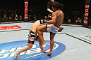 SAITAMA, JAPAN - FEBRUARY 26:  (R-L) Benson Henderson delivers a knee strike against Frankie Edgar during the UFC 144 event at Saitama Super Arena on February 26, 2012 in Saitama, Japan.  (Photo by Al Bello/Zuffa LLC/Zuffa LLC via Getty Images) *** Local Caption *** Frankie Edgar; Benson Henderson