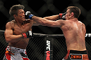 SAITAMA, JAPAN - FEBRUARY 26:  (R-L) Jake Shields and Yoshihiro Akiyama trade punches during the UFC 144 event at Saitama Super Arena on February 26, 2012 in Saitama, Japan.  (Photo by Josh Hedges/Zuffa LLC/Zuffa LLC via Getty Images) *** Local Caption *** Yoshihiro Akiyama; Jake Shields