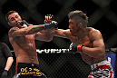 SAITAMA, JAPAN - FEBRUARY 26:  (R-L) Yoshihiro Akiyama punches Jake Shields during the UFC 144 event at Saitama Super Arena on February 26, 2012 in Saitama, Japan.  (Photo by Josh Hedges/Zuffa LLC/Zuffa LLC via Getty Images) *** Local Caption *** Yoshihiro Akiyama; Jake Shields