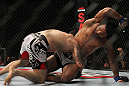 SAITAMA, JAPAN - FEBRUARY 26:  (R-L) Benson Henderson delivers an elbow strike against Frankie Edgar during the UFC 144 event at Saitama Super Arena on February 26, 2012 in Saitama, Japan.  (Photo by Josh Hedges/Zuffa LLC/Zuffa LLC via Getty Images) *** Local Caption *** Frankie Edgar; Benson Henderson