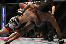 SAITAMA, JAPAN - FEBRUARY 26:  (L-R) Frankie Edgar takes down Benson Henderson during the UFC 144 event at Saitama Super Arena on February 26, 2012 in Saitama, Japan.  (Photo by Josh Hedges/Zuffa LLC/Zuffa LLC via Getty Images) *** Local Caption *** Frankie Edgar; Benson Henderson