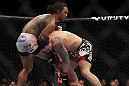 SAITAMA, JAPAN - FEBRUARY 26:  (R-L) Frankie Edgar attempts to take down Benson Henderson during the UFC 144 event at Saitama Super Arena on February 26, 2012 in Saitama, Japan.  (Photo by Josh Hedges/Zuffa LLC/Zuffa LLC via Getty Images) *** Local Caption *** Frankie Edgar; Benson Henderson