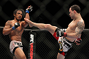 SAITAMA, JAPAN - FEBRUARY 26:  (R-L) Frankie Edgar kicks Benson Henderson during the UFC 144 event at Saitama Super Arena on February 26, 2012 in Saitama, Japan.  (Photo by Josh Hedges/Zuffa LLC/Zuffa LLC via Getty Images) *** Local Caption *** Frankie Edgar; Benson Henderson