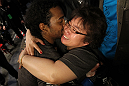SAITAMA, JAPAN - FEBRUARY 26:  (L-R) Benson Henderson celebrates with his mother Song after defeating Frankie Edgar to win the UFC Lightweight Championship during the UFC 144 event at Saitama Super Arena on February 26, 2012 in Saitama, Japan.  (Photo by Josh Hedges/Zuffa LLC/Zuffa LLC via Getty Images) *** Local Caption *** Benson Henderson; Song Henderson