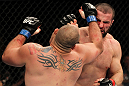 SYDNEY, AUSTRALIA - MARCH 03:  (R-L) Oli Thompson punches Shawn Jordan in a heavyweight bout during the UFC on FX event at Allphones Arena on March 3, 2012 in Sydney, Australia.  (Photo by Josh Hedges/Zuffa LLC/Zuffa LLC via Getty Images) *** Local Caption *** Oli Thompson; Shawn Jordan