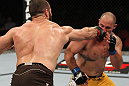 SYDNEY, AUSTRALIA - MARCH 03:  (L-R) Oli Thompson punches Shawn Jordan in a heavyweight bout during the UFC on FX event at Allphones Arena on March 3, 2012 in Sydney, Australia.  (Photo by Josh Hedges/Zuffa LLC/Zuffa LLC via Getty Images) *** Local Caption *** Oli Thompson; Shawn Jordan