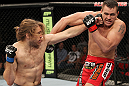SYDNEY, AUSTRALIA - MARCH 03:  (L-R) Andrew Craig punches Kyle Noke during a middleweight bout during the UFC on FX event at Allphones Arena on March 3, 2012 in Sydney, Australia.  (Photo by Josh Hedges/Zuffa LLC/Zuffa LLC via Getty Images) *** Local Caption *** Kyle Noke; Andrew Craig
