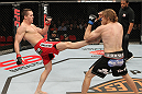 SYDNEY, AUSTRALIA - MARCH 03:  (L-R) Kyle Noke kicks Andrew Craig in their middleweight bout during the UFC on FX event at Allphones Arena on March 3, 2012 in Sydney, Australia.  (Photo by Josh Hedges/Zuffa LLC/Zuffa LLC via Getty Images) *** Local Caption *** Kyle Noke; Andrew Craig