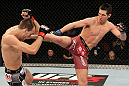 SYDNEY, AUSTRALIA - MARCH 03:  (R-L) Steven Siler kicks Cole Miller in a featherweight bout during the UFC on FX event at Allphones Arena on March 3, 2012 in Sydney, Australia.  (Photo by Josh Hedges/Zuffa LLC/Zuffa LLC via Getty Images) *** Local Caption *** Cole Miller; Steven Siler