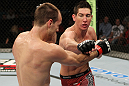 SYDNEY, AUSTRALIA - MARCH 03:  (R-L) Steven Siler punches Cole Miller in a featherweight bout during the UFC on FX event at Allphones Arena on March 3, 2012 in Sydney, Australia.  (Photo by Josh Hedges/Zuffa LLC/Zuffa LLC via Getty Images) *** Local Caption *** Cole Miller; Steven Siler