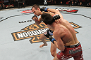 SYDNEY, AUSTRALIA - MARCH 03:  (R-L) Steven Siler punches Cole Miller in a featherweight bout during the UFC on FX event at Allphones Arena on March 3, 2012 in Sydney, Australia.  (Photo by Josh Hedges/Zuffa LLC/Zuffa LLC via Getty Images) *** Local Caption *** Cole Miller; Steven Siler