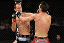 SYDNEY, AUSTRALIA - MARCH 03:  (R-L) Steven Siler and Cole Miller trade punches in a featherweight bout during the UFC on FX event at Allphones Arena on March 3, 2012 in Sydney, Australia.  (Photo by Josh Hedges/Zuffa LLC/Zuffa LLC via Getty Images) *** Local Caption *** Cole Miller; Steven Siler