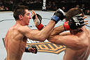 SYDNEY, AUSTRALIA - MARCH 03:  (L-R) Steven Siler punches Cole Miller in a featherweight bout during the UFC on FX event at Allphones Arena on March 3, 2012 in Sydney, Australia.  (Photo by Josh Hedges/Zuffa LLC/Zuffa LLC via Getty Images) *** Local Caption *** Cole Miller; Steven Siler