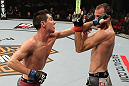 SYDNEY, AUSTRALIA - MARCH 03:  (L-R) Steven Siler punches Cole Miller in a featherweight bout during the UFC on FX event at Allphones Arena on March 3, 2012 in Sydney, Australia.  (Photo by Josh Hedges/Zuffa LLC/Zuffa LLC via Getty Images) *** Local Caption *** Cole Miller; Steven Siler