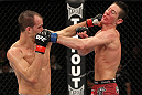 SYDNEY, AUSTRALIA - MARCH 03:  (R-L) Steven Siler and Cole Miller trade punches in a featherweight bout during the UFC on FX event at Allphones Arena on March 3, 2012 in Sydney, Australia.  (Photo by Josh Hedges/Zuffa LLC/Zuffa LLC via Getty Images) *** Local Caption *** Cole Miller; Steven Siler