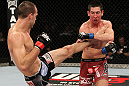 SYDNEY, AUSTRALIA - MARCH 03:  (L-R) Cole Miller kicks Steven Siler in a featherweight bout during the UFC on FX event at Allphones Arena on March 3, 2012 in Sydney, Australia.  (Photo by Josh Hedges/Zuffa LLC/Zuffa LLC via Getty Images) *** Local Caption *** Cole Miller; Steven Siler
