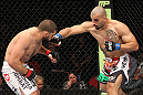 SYDNEY, AUSTRALIA - MARCH 03:  (R-L) Constantinos Philippou punches Court McGee in a middleweight bout during the UFC on FX event at Allphones Arena on March 3, 2012 in Sydney, Australia.  (Photo by Josh Hedges/Zuffa LLC/Zuffa LLC via Getty Images) *** Local Caption *** Court McGee; Constantinos Philippou