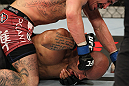SYDNEY, AUSTRALIA - MARCH 03:  Ian McCall punches down at Demetrious Johnson in a flyweight bout during the UFC on FX event at Allphones Arena on March 3, 2012 in Sydney, Australia.  (Photo by Josh Hedges/Zuffa LLC/Zuffa LLC via Getty Images) *** Local Caption *** Demetrious Johnson; Ian McCall