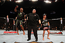 SYDNEY, AUSTRALIA - MARCH 03:  Demetrious Johnson (L) reacts after winning a decision over Ian McCall (R) in a flyweight bout during the UFC on FX event at Allphones Arena on March 3, 2012 in Sydney, Australia.  (Photo by Josh Hedges/Zuffa LLC/Zuffa LLC via Getty Images) *** Local Caption *** Demetrious Johnson; Ian McCall
