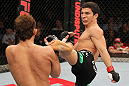 SYDNEY, AUSTRALIA - MARCH 03:  (R-L) Joseph Benavidez kicks Yasuhiro Urushitani in a flyweight bout during the UFC on FX event at Allphones Arena on March 3, 2012 in Sydney, Australia.  (Photo by Josh Hedges/Zuffa LLC/Zuffa LLC via Getty Images) *** Local Caption *** Joseph Benavidez; Yasuhiro Urushitani