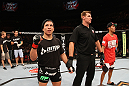 SYDNEY, AUSTRALIA - MARCH 03:  Joseph Benavidez (L) reacts after knocking out Yasuhiro Urushitani (R) in a flyweight bout during the UFC on FX event at Allphones Arena on March 3, 2012 in Sydney, Australia.  (Photo by Josh Hedges/Zuffa LLC/Zuffa LLC via Getty Images) *** Local Caption *** Joseph Benavidez; Yasuhiro Urushitani