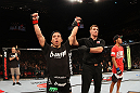 SYDNEY, AUSTRALIA - MARCH 03:  Joseph Benavidez (L) reacts after knocking out Yasuhiro Urushitani (R) in a flyweight bout during the UFC on FX event at Allphones Arena on March 3, 2012 in Sydney, Australia.  (Photo by Josh Hedges/Zuffa LLC/Zuffa LLC via Getty Images) *** Local Caption *** Joseph Benavidez; Yasuhiro Urushitani