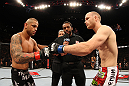 SYDNEY, AUSTRALIA - MARCH 03:  (L-R) Welterweight opponents Thiago Alves and Martin Kampmann receive final instructions from referee Herb Dean before their main event bout during the UFC on FX event at Allphones Arena on March 3, 2012 in Sydney, Australia.  (Photo by Josh Hedges/Zuffa LLC/Zuffa LLC via Getty Images) *** Local Caption *** Thiago Alves; Martin Kampmann; Herb Dean