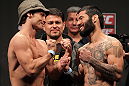 STOCKHOLM, SWEDEN - APRIL 13:  (L-R) Bantamweight opponents Brad Pickett and Damacio Page face off after weighing in during the official UFC on Fuel TV weigh in event at Ericsson Globe on April 13, 2012 in Stockholm, Sweden.  (Photo by Josh Hedges/Zuffa LLC/Zuffa LLC via Getty Images)