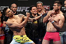 STOCKHOLM, SWEDEN - APRIL 13:  (L-R) Welterweight opponents DaMarques Johnson and John Maguire face off after weighing in during the official UFC on Fuel TV weigh in event at Ericsson Globe on April 13, 2012 in Stockholm, Sweden.  (Photo by Josh Hedges/Zuffa LLC/Zuffa LLC via Getty Images)