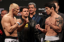 STOCKHOLM, SWEDEN - APRIL 13:  (L-R) Featherweight opponents Dennis Siver and Diego Nunes face off after weighing in during the official UFC on Fuel TV weigh in event at Ericsson Globe on April 13, 2012 in Stockholm, Sweden.  (Photo by Josh Hedges/Zuffa LLC/Zuffa LLC via Getty Images)