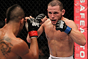 STOCKHOLM, SWEDEN - APRIL 14:  (R-L) Eric Wisely faces off with Jason Young during their featherweight bout at the UFC on Fuel TV event at Ericsson Globe on April 14, 2012 in Stockholm, Sweden.  (Photo by Josh Hedges/Zuffa LLC/Zuffa LLC via Getty Images)