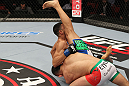 STOCKHOLM, SWEDEN - APRIL 14:  (L-R) Reza Madadi slams Yoislandy Izquierdo to the mat during their lightweight bout at the UFC on Fuel TV event at Ericsson Globe on April 14, 2012 in Stockholm, Sweden.  (Photo by Josh Hedges/Zuffa LLC/Zuffa LLC via Getty Images)