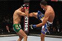 STOCKHOLM, SWEDEN - APRIL 14:  (R-L) Yoislandy Izquierdo kicks Reza Madadi during their lightweight bout at the UFC on Fuel TV event at Ericsson Globe on April 14, 2012 in Stockholm, Sweden.  (Photo by Josh Hedges/Zuffa LLC/Zuffa LLC via Getty Images)