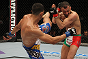 STOCKHOLM, SWEDEN - APRIL 14:  (L-R) Yoislandy Izquierdo kicks Reza Madadi during their lightweight bout at the UFC on Fuel TV event at Ericsson Globe on April 14, 2012 in Stockholm, Sweden.  (Photo by Josh Hedges/Zuffa LLC/Zuffa LLC via Getty Images)