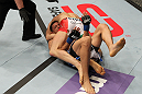 STOCKHOLM, SWEDEN - APRIL 14:  (R-L) Reza Madadi secures a guillotine choke submission against Yoislandy Izquierdo during their lightweight bout at the UFC on Fuel TV event at Ericsson Globe on April 14, 2012 in Stockholm, Sweden.  (Photo by Josh Hedges/Zuffa LLC/Zuffa LLC via Getty Images)