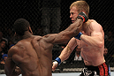 STOCKHOLM, SWEDEN - APRIL 14:  (L-R) Papy Abedi punches James Head during their welterweight bout at the UFC on Fuel TV event at Ericsson Globe on April 14, 2012 in Stockholm, Sweden.  (Photo by Josh Hedges/Zuffa LLC/Zuffa LLC via Getty Images)