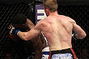 STOCKHOLM, SWEDEN - APRIL 14:  (R-L) James Head punches Papy Abedi during their welterweight bout at the UFC on Fuel TV event at Ericsson Globe on April 14, 2012 in Stockholm, Sweden.  (Photo by Josh Hedges/Zuffa LLC/Zuffa LLC via Getty Images)