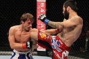 STOCKHOLM, SWEDEN - APRIL 14:  (R-L) Damacio Page delivers a knee strike against Brad Pickett during their bantamweight bout at the UFC on Fuel TV event at Ericsson Globe on April 14, 2012 in Stockholm, Sweden.  (Photo by Josh Hedges/Zuffa LLC/Zuffa LLC via Getty Images)