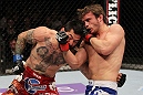 STOCKHOLM, SWEDEN - APRIL 14:  (R-L) Brad Pickett punches Damacio Page during their bantamweight bout at the UFC on Fuel TV event at Ericsson Globe on April 14, 2012 in Stockholm, Sweden.  (Photo by Josh Hedges/Zuffa LLC/Zuffa LLC via Getty Images)