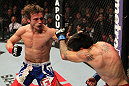 STOCKHOLM, SWEDEN - APRIL 14:  (L-R) Brad Pickett punches Damacio Page during their bantamweight bout at the UFC on Fuel TV event at Ericsson Globe on April 14, 2012 in Stockholm, Sweden.  (Photo by Josh Hedges/Zuffa LLC/Zuffa LLC via Getty Images)