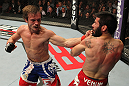 STOCKHOLM, SWEDEN - APRIL 14:  (L-R) Brad Pickett punches Damacio Page during their bantamweight bout at the UFC on Fuel TV event at Ericsson Globe on April 14, 2012 in Stockholm, Sweden.  (Photo by Josh Hedges/Zuffa LLC/Zuffa LLC via Getty Images)