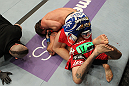 STOCKHOLM, SWEDEN - APRIL 14:  (L-R) Brad Pickett defeats Damacio Page with a rear choke submission in a bantamweight bout at the UFC on Fuel TV event at Ericsson Globe on April 14, 2012 in Stockholm, Sweden.  (Photo by Josh Hedges/Zuffa LLC/Zuffa LLC via Getty Images)
