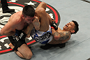 STOCKHOLM, SWEDEN - APRIL 14:  (R-L) DaMarques Johnson attempts a shoulder lock submission against John Maguire during their welterweight bout at the UFC on Fuel TV event at Ericsson Globe on April 14, 2012 in Stockholm, Sweden.  (Photo by Josh Hedges/Zuffa LLC/Zuffa LLC via Getty Images)