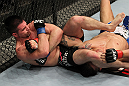 STOCKHOLM, SWEDEN - APRIL 14:  (L-R) John Maguire secures an arm bar submission against Damarques Johnson during their welterweight bout at the UFC on Fuel TV event at Ericsson Globe on April 14, 2012 in Stockholm, Sweden.  (Photo by Josh Hedges/Zuffa LLC/Zuffa LLC via Getty Images)
