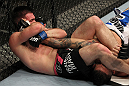 STOCKHOLM, SWEDEN - APRIL 14:  (L-R) John Maguire secures an arm bar submission against Damarques Johnson during their welterweight bout at the UFC on Fuel TV event at Ericsson Globe on April 14, 2012 in Stockholm, Sweden.  (Photo by Josh Hedges/Zuffa LLC/Zuffa LLC via Getty Images)