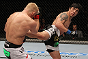 STOCKHOLM, SWEDEN - APRIL 14:  (R-L) Diego Nunes kicks Dennis Siver during their featherweight bout at the UFC on Fuel TV event at Ericsson Globe on April 14, 2012 in Stockholm, Sweden.  (Photo by Josh Hedges/Zuffa LLC/Zuffa LLC via Getty Images)